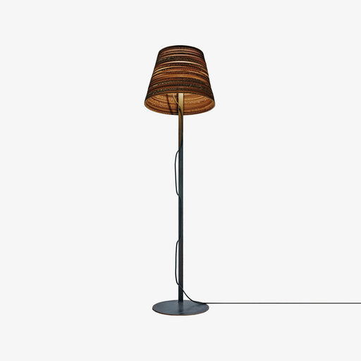 designer floor lamp with tilted shade made from sustainable recycled cardboard