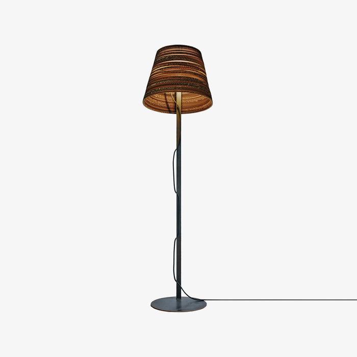 designer floor lamp with tilted shade made from sustainable recycled cardboard