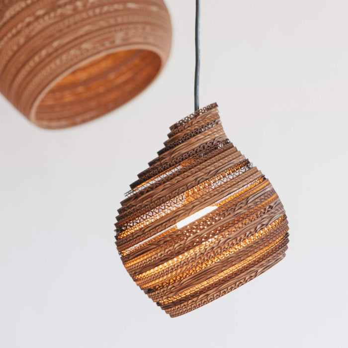 beehive shaped pendant light made from recycled cardboard