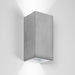 Wall light in rectangular shape made from light grey concrete with a silver coloured inside plating